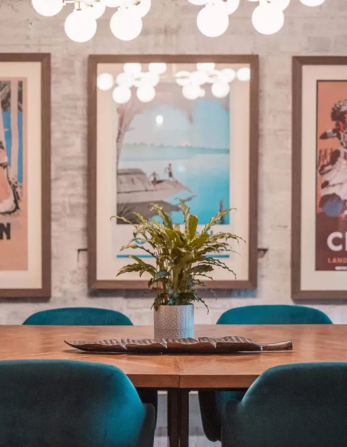 Upper meeting room with brick walls and a hanging lamp
